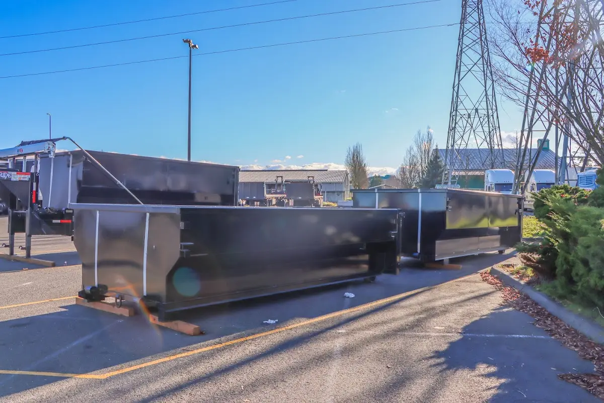 Roll-off dumpster ready for waste disposal at job site for 10 Yard Dumpster Rental in June Park